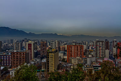 High angle view of buildings in city against sky