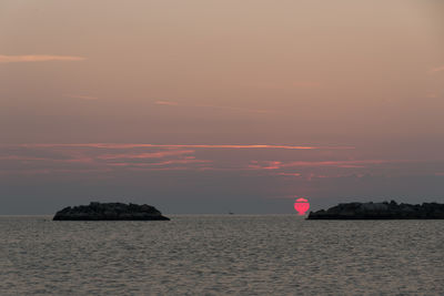 Scenic view of sea at sunset