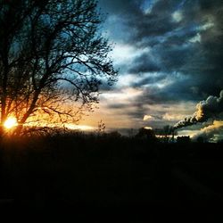 Scenic view of landscape against cloudy sky