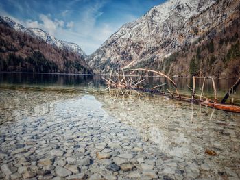 Scenic view of lake and mountains against sky