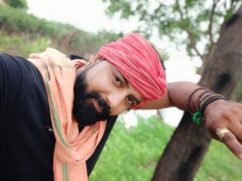 Portrait of young woman in park