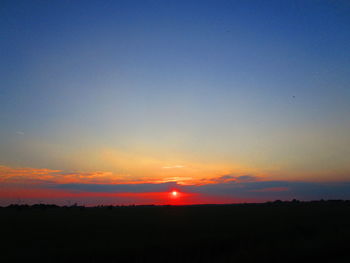 Scenic view of silhouette landscape against sky during sunset