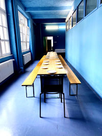 Empty chairs and tables in building