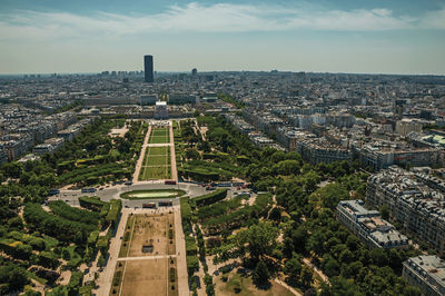 Champ de mars park and cityscape seen from the eiffel tower in paris. the famous capital of france.