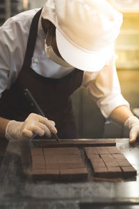 Chef preparing chocolates at restaurant