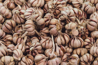 Full frame shot of garlic bulbs for sale at market