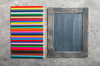 High angle view of multi colored books on table