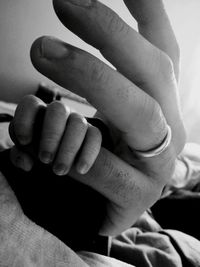 Close-up of couple holding hands