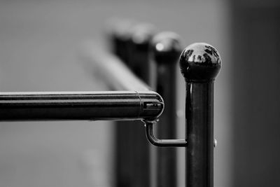 Close-up of pipe on railing