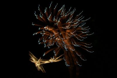Close-up of fireworks over sea