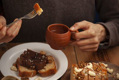 Midsection of person having breakfast