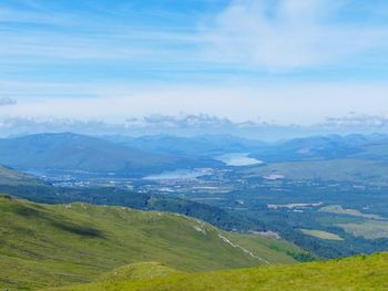 Scenic view of landscape and mountains against sky