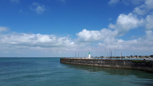 Scenic view of sea and pier against sky