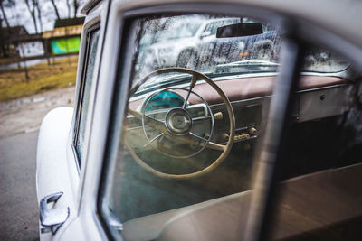 Close-up of vintage car on side-view mirror