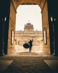 Woman walking in historic building