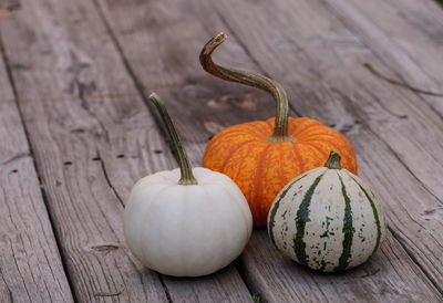 Close-up of squashes on boardwalk