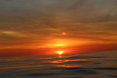 Scenic view of dramatic sky during sunset