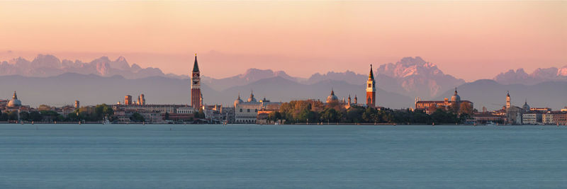 Panoramic view of buildings against sky during sunset