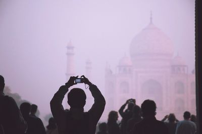 People photographing taj mahal