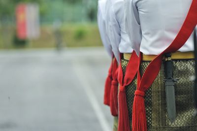 Rear view of man with red umbrella