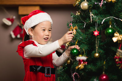 Cute boy with christmas tree