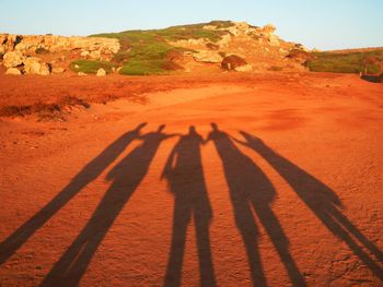 High angle view of people shadow on land