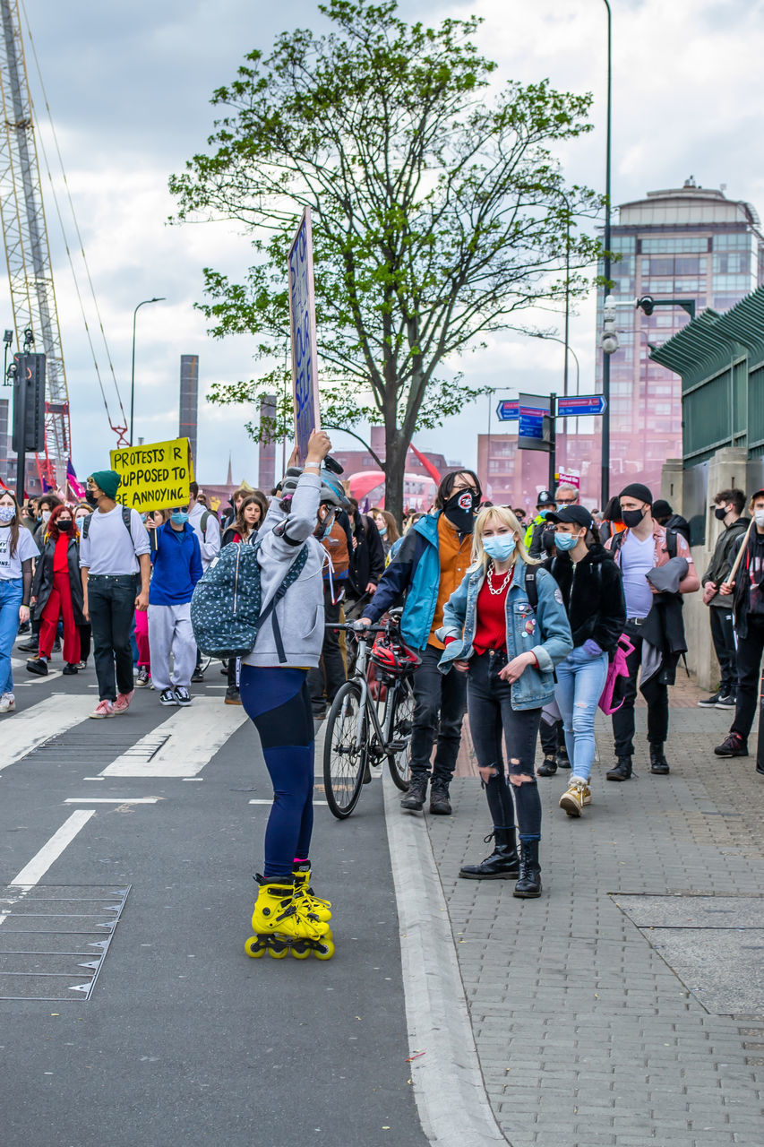 CROWD ON CITY STREET