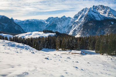 Scenic view of snowcapped mountains against sky during winter