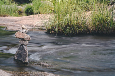 Scenic view of river flowing through rocks