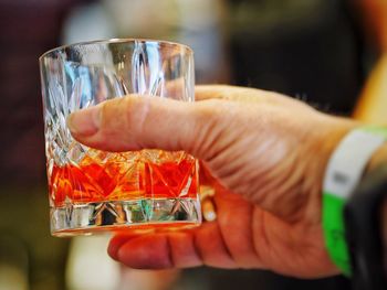 Close-up of hand holding drink