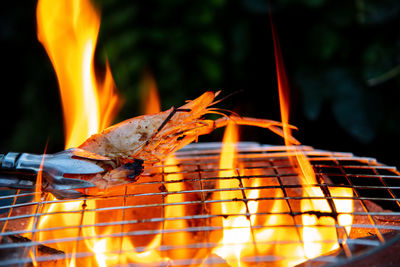 Close-up of fire on barbecue grill