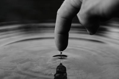 Close-up of hand holding water