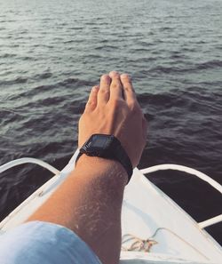 Low section of man on boat in sea