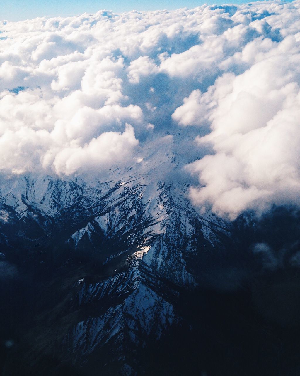 AERIAL VIEW OF CLOUDS OVER SNOW