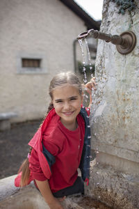 Portrait of boy playing in park