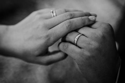 Close-up of couple holding hands