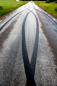 Tire tracks on road