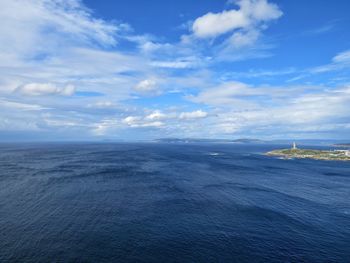 Scenic view of sea against blue sky