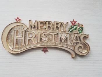 Close-up of merry christmas text on wall