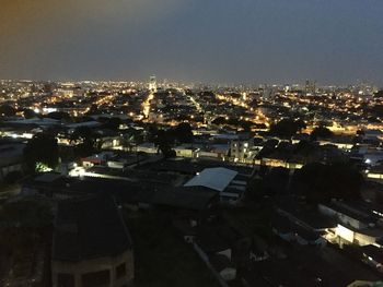 High angle view of illuminated buildings in city at night