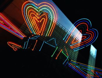 Low angle view of illuminated building at night