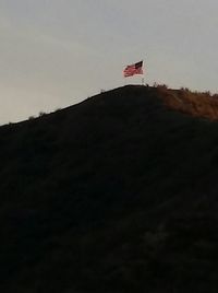 Close-up of red wall against sky