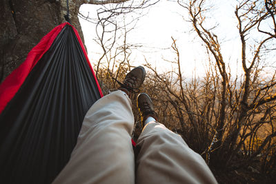 Low section of woman relaxing outdoors