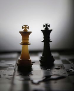 Close-up of chess pieces on table