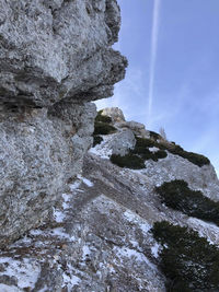 Low angle view of rock formation against sky