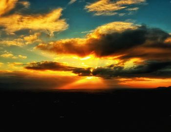 Scenic view of dramatic sky during sunset