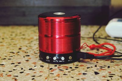 Close-up of red light painting on table