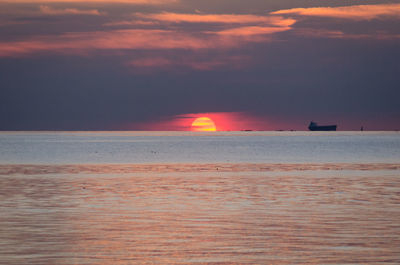 Scenic view of sea at sunset