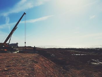 Scenic view of construction site against sky