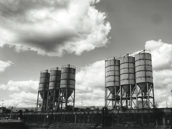 Low angle view of factory against sky